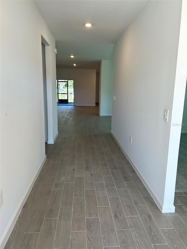 hall with dark hardwood / wood-style floors