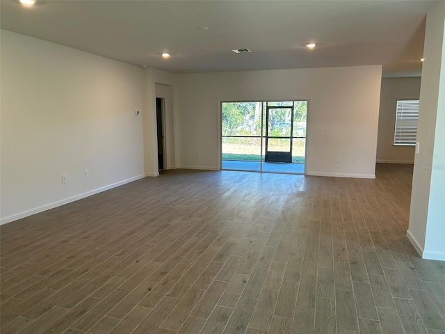 spare room featuring hardwood / wood-style floors