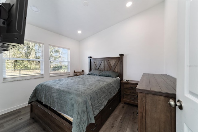 bedroom with dark hardwood / wood-style floors and vaulted ceiling