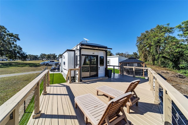 wooden deck featuring a gazebo