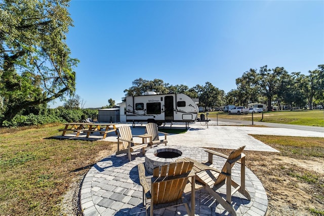 view of patio / terrace with a fire pit