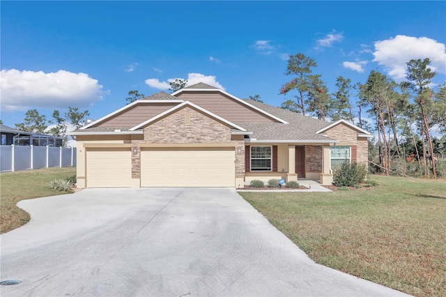 view of front facade with a garage and a front lawn