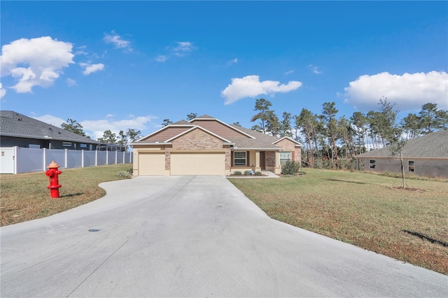 view of front of home with a front yard and a garage