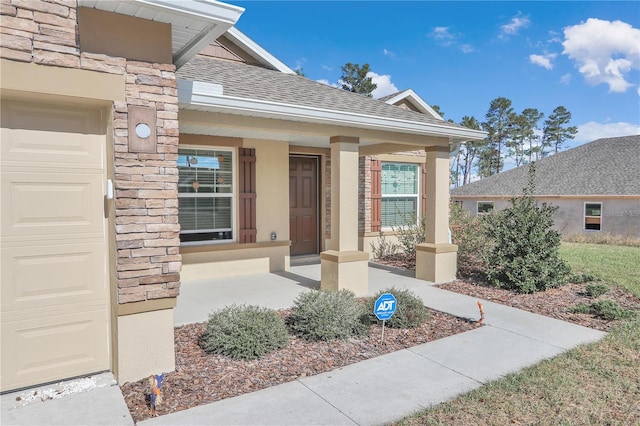 4313 SW 106th Pl, Ocala, FL 34476 - doorway to property with a porch, a shingled roof, stone siding, and stucco siding