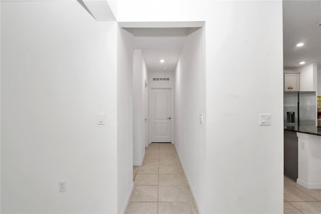 hall with light tile patterned flooring