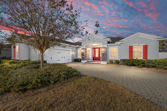 ranch-style house featuring a garage