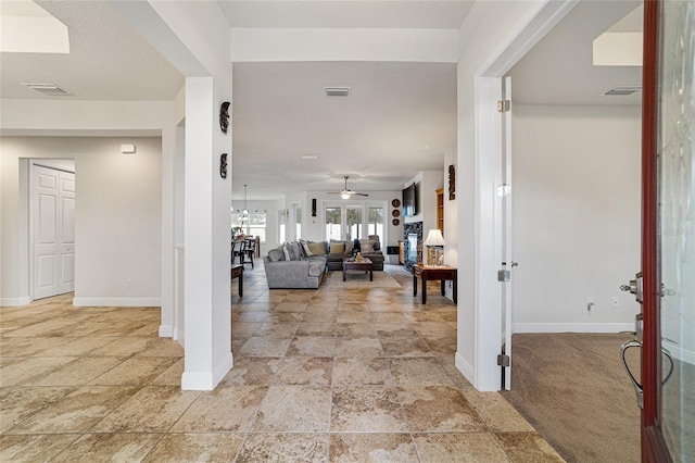 foyer with ceiling fan