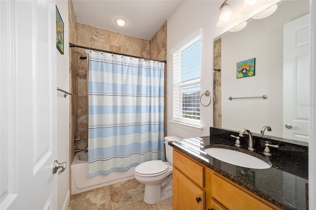 full bathroom featuring tile patterned flooring, vanity, shower / tub combo with curtain, and toilet