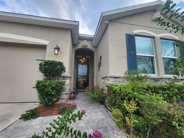 view of exterior entry featuring a garage