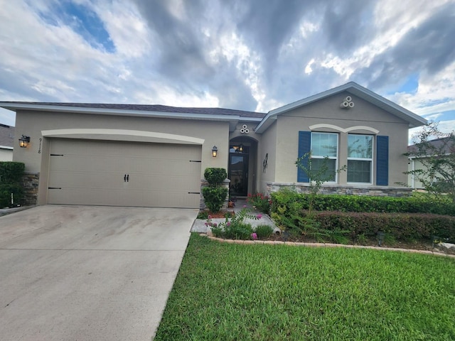 single story home with a front yard and a garage