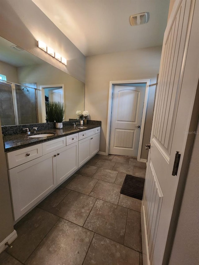 bathroom featuring vanity and walk in shower