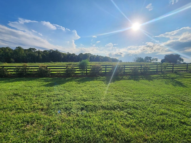 view of yard with a rural view