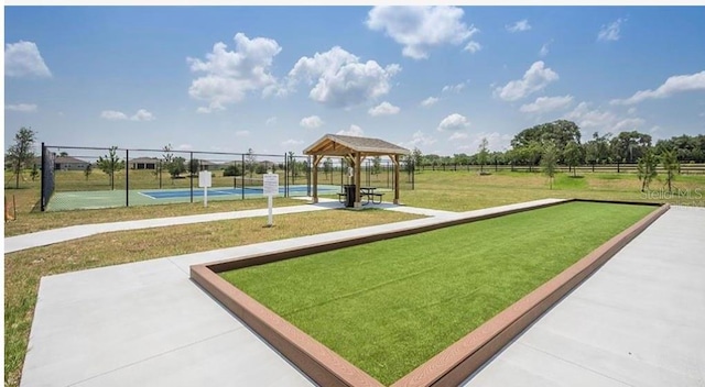 view of home's community featuring a gazebo, a yard, and tennis court