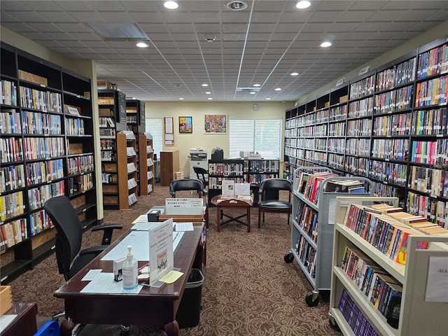 office space featuring carpet floors and a paneled ceiling