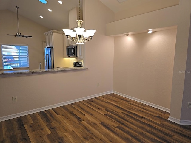 unfurnished dining area with high vaulted ceiling, dark wood-type flooring, and a chandelier