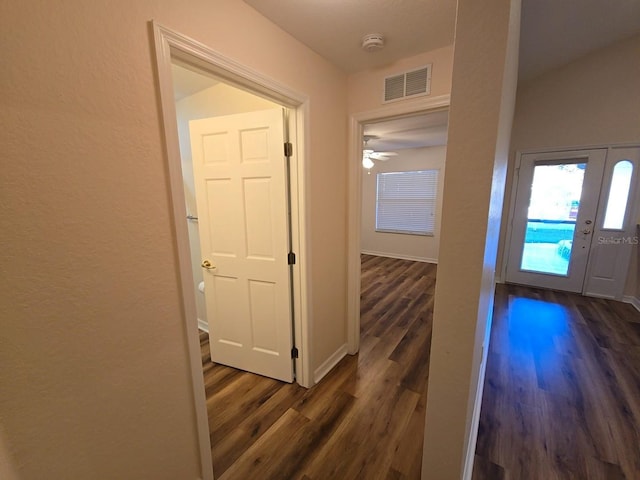 corridor featuring dark hardwood / wood-style floors