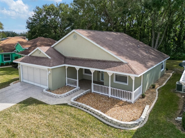 view of front of property with central AC, a garage, covered porch, and a front lawn