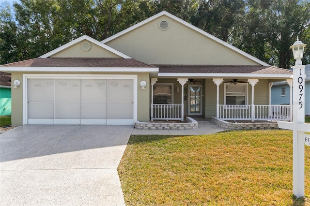 view of front of property with a garage, ceiling fan, a front yard, and covered porch