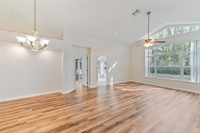 unfurnished living room featuring ceiling fan with notable chandelier, lofted ceiling, and light hardwood / wood-style floors