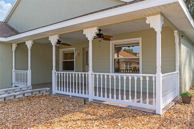 doorway to property featuring ceiling fan and a porch