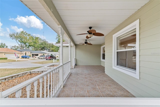 view of patio featuring ceiling fan and a porch