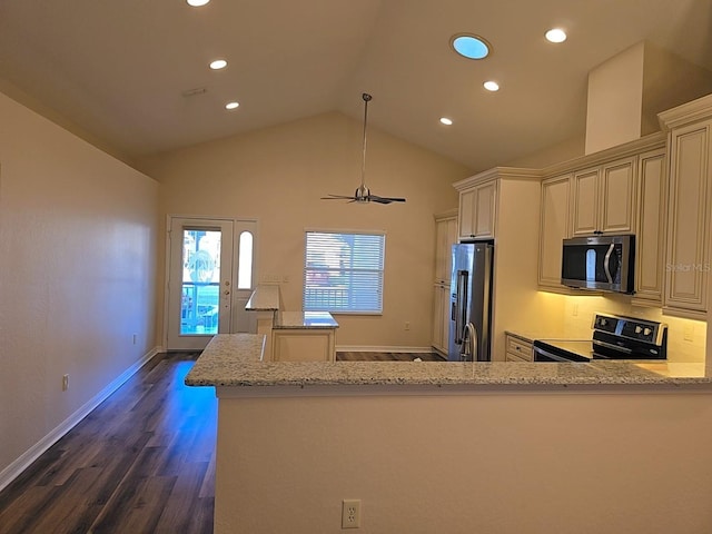 kitchen featuring appliances with stainless steel finishes, dark wood-type flooring, light stone counters, and kitchen peninsula