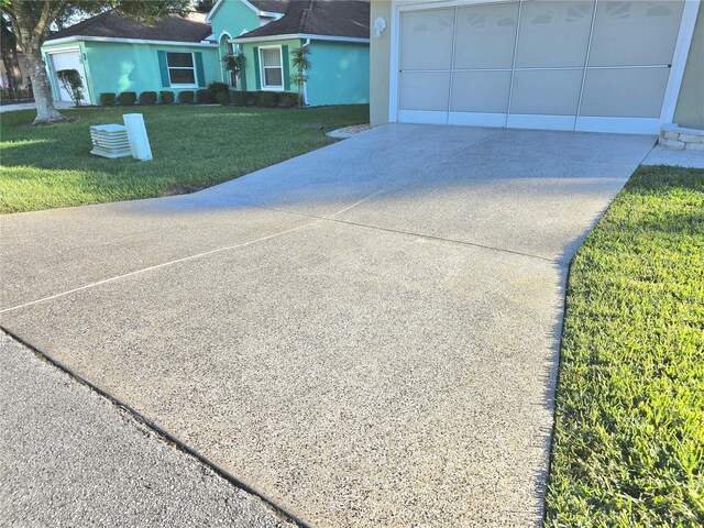 view of front of house with a garage and a front yard