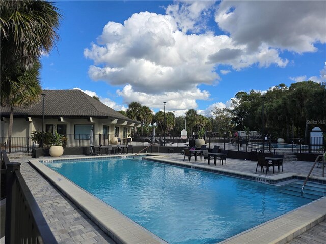 view of swimming pool featuring a patio