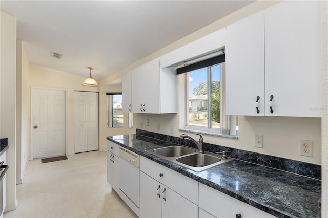 kitchen featuring white cabinetry, sink, white dishwasher, pendant lighting, and vaulted ceiling