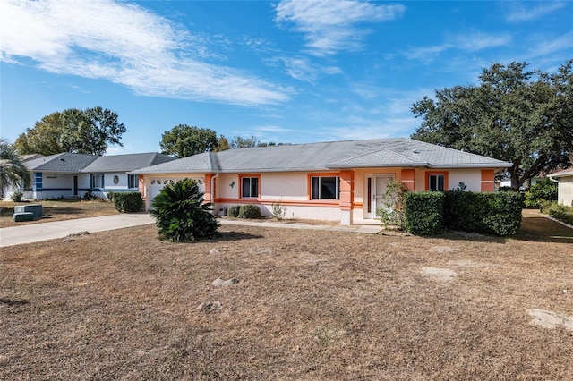 ranch-style house featuring a garage