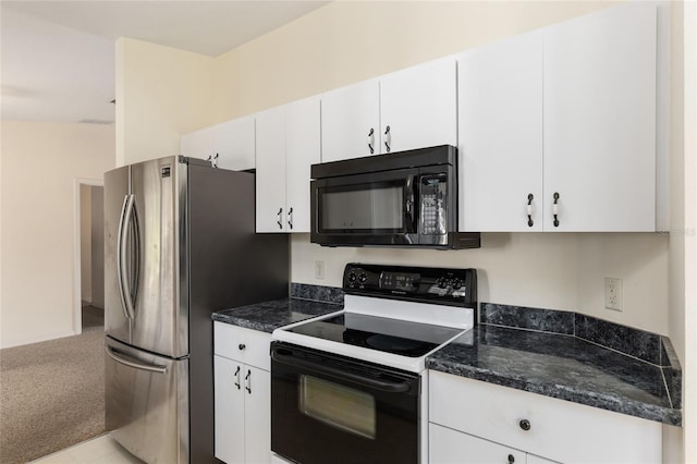 kitchen with stainless steel refrigerator, light carpet, white cabinets, and electric range oven