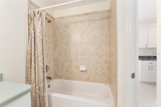 bathroom featuring vanity and shower / tub combo with curtain