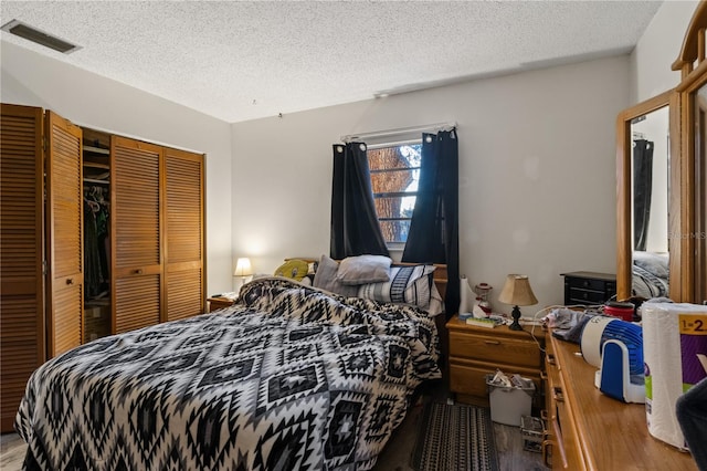 bedroom featuring a closet and a textured ceiling