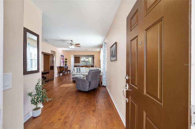 foyer entrance with ceiling fan and hardwood / wood-style floors