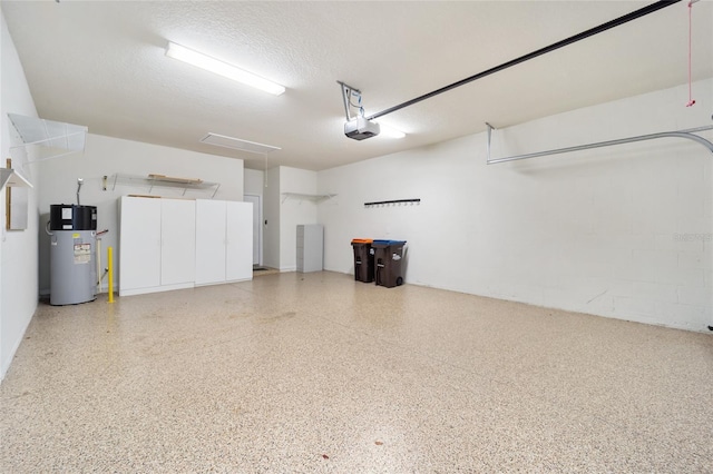 garage with heat pump water heater and a garage door opener