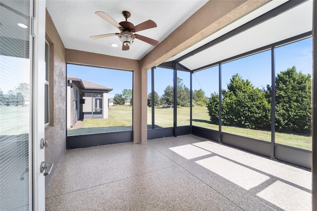 unfurnished sunroom with ceiling fan