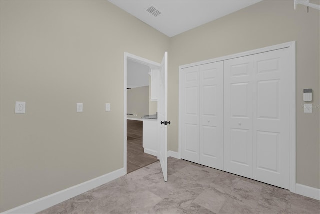 unfurnished bedroom with a closet