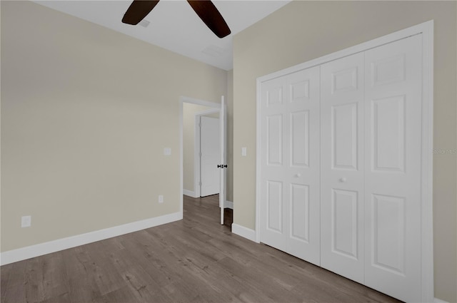 unfurnished bedroom featuring a closet, ceiling fan, and light hardwood / wood-style flooring