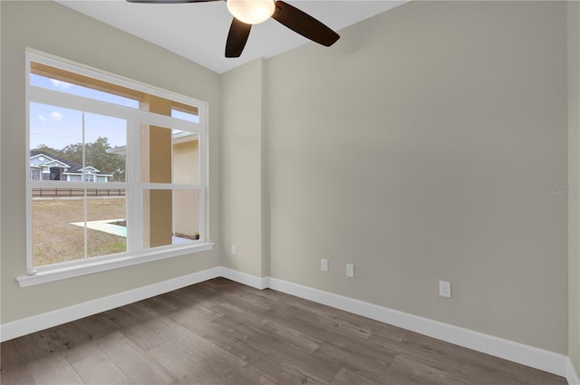 unfurnished room featuring ceiling fan and hardwood / wood-style flooring