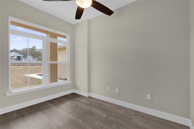 12205 SW 71st Lane Rd, Ocala, FL 34481 - spare room with dark wood-type flooring and ceiling fan
