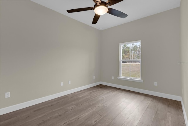 unfurnished room with ceiling fan and light wood-type flooring