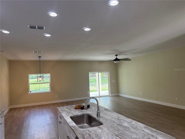 12205 SW 71st Lane Rd, Ocala, FL 34481 - kitchen with wood finished floors, healthy amount of natural light, open floor plan, and recessed lighting
