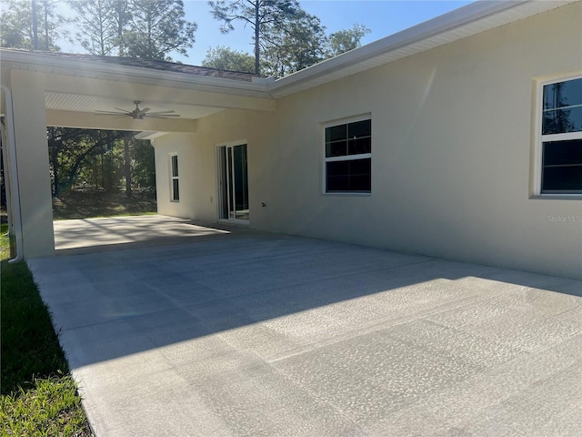 12205 SW 71st Lane Rd, Ocala, FL 34481 - view of patio with ceiling fan and concrete driveway