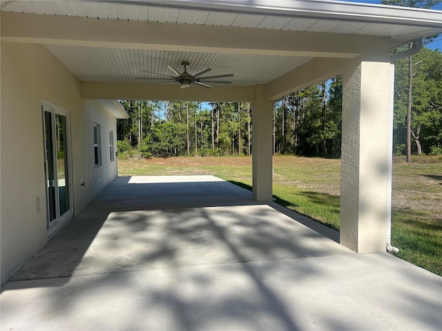 12205 SW 71st Lane Rd, Ocala, FL 34481 - view of patio / terrace featuring a ceiling fan and view of wooded area