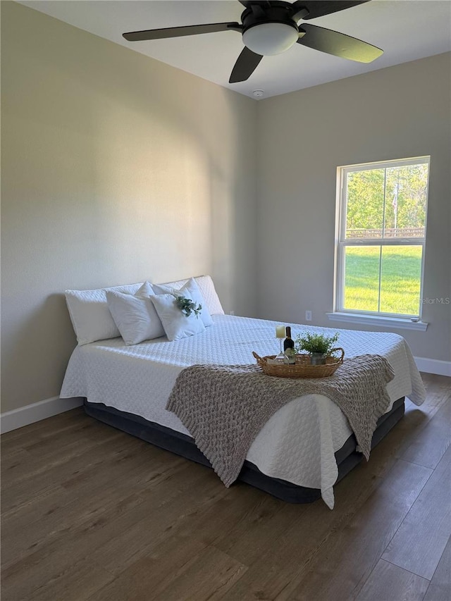 12205 SW 71st Lane Rd, Ocala, FL 34481 - bedroom with dark wood-type flooring and a ceiling fan