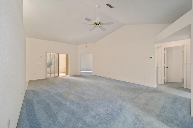 carpeted spare room featuring ceiling fan and lofted ceiling