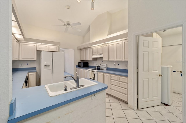 kitchen with electric range oven, tasteful backsplash, high vaulted ceiling, white refrigerator with ice dispenser, and light tile patterned floors