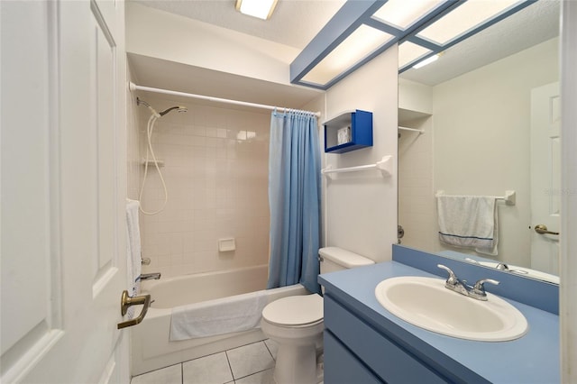 full bathroom with tile patterned flooring, vanity, toilet, and shower / bath combo with shower curtain