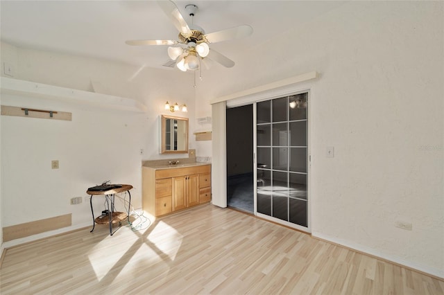 bathroom featuring hardwood / wood-style flooring and ceiling fan