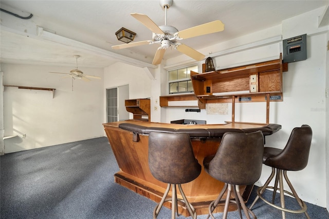 bar featuring carpet, ceiling fan, and lofted ceiling